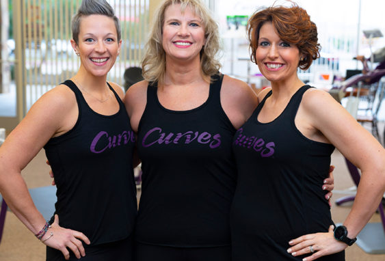 Three Women Wearing Curves Singlets