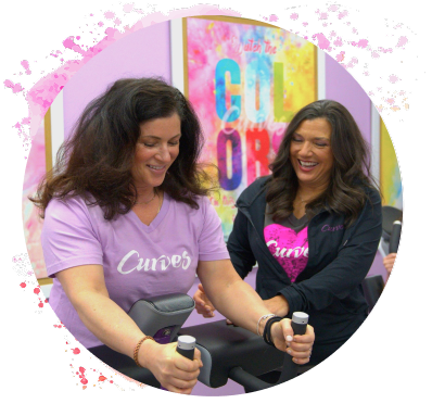 Curves member exercising with a coach