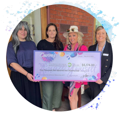 Curves charity donation presentation with community representatives
